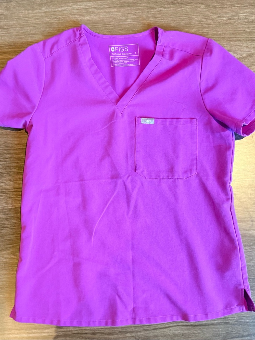 FIGS fuchsia scrub top